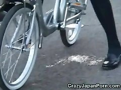 Schoolgirl Splatters on a Bike in Public! 