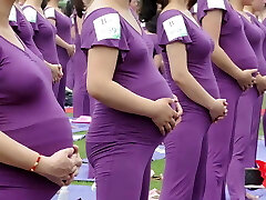 Pregnant Asian women doing yoga (non pornography)