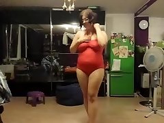 Fat chick does a strip tease