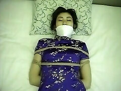 Chinese dress woman strapped up and gagged