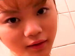 Cute petite Japanese girlie takes bathroom flashing her nice ass and titties