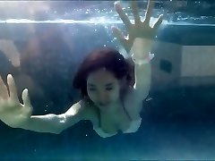 Young Asian Girl in Sexy Bathing Suit at a Swimming Pool