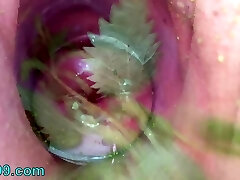 Extreme female inserting nettles into cervix and beef whistle flowers