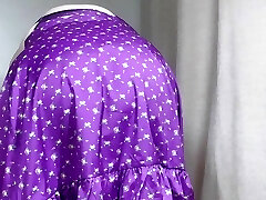 Mature Sally in short lilac micro-skirt, showing off her assets
