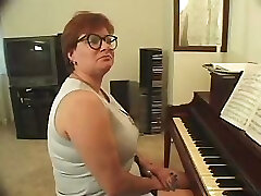 Plump piano teacher busted getting skewered with two knobs