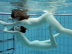 Cute teen damsel Anna Netrebko swims naked with her GF