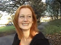 Redhead shows her tits & ass outdoors