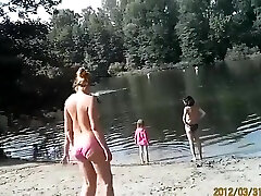 Sunny day at the nudist camp by the sea