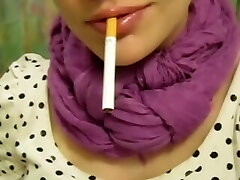 Russian girl smoking. Good-sized exhales.