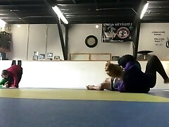 a highly skilled and flexible dancer is kicking boys ass in grappling compl