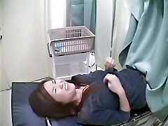 A fresh girl is examined on the gynecological table in this warm medical voyeur video