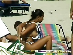 Appetizing party chicks flashing their big tits on the beach