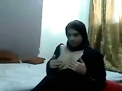 Middle East first-timer brunette nympho in traditional gown shows off her tits