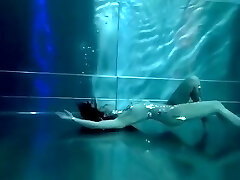 Bond Lady, underwater stunts, bore girl, high heels glamor and underwater swimming retro style 