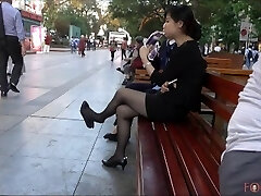 Chinese Office Lady having a break and suspending her heels