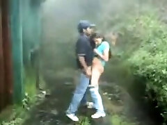 British Indian couple drill in rain storm at hill station