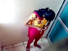 Some amateur Indian brown-haired girls peeing in the toilet on voyeur cam