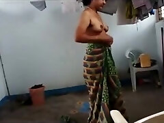 Indian wife with saggy melons puts on her clothes