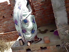 Beautiful Indian bhabhi pissing on her house roof and fingering her cremei cock-squeezing pussy