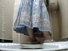 White mature lady in dress pisses in the toilet room