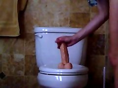 Soccer Mom with big boobs ride a Dildo on Rest Room
