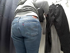 In a fitting room in a public store, the camera caught a chubby milf with a killer culo in transparent underpants. PAWG.