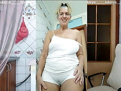 Lukerya in the kitchen in wet white panties, bottom look