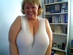 Obese mature blond haired housewife likes bragging of her huge boobies