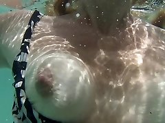 mature GF shows bikini boobies under water in vacation