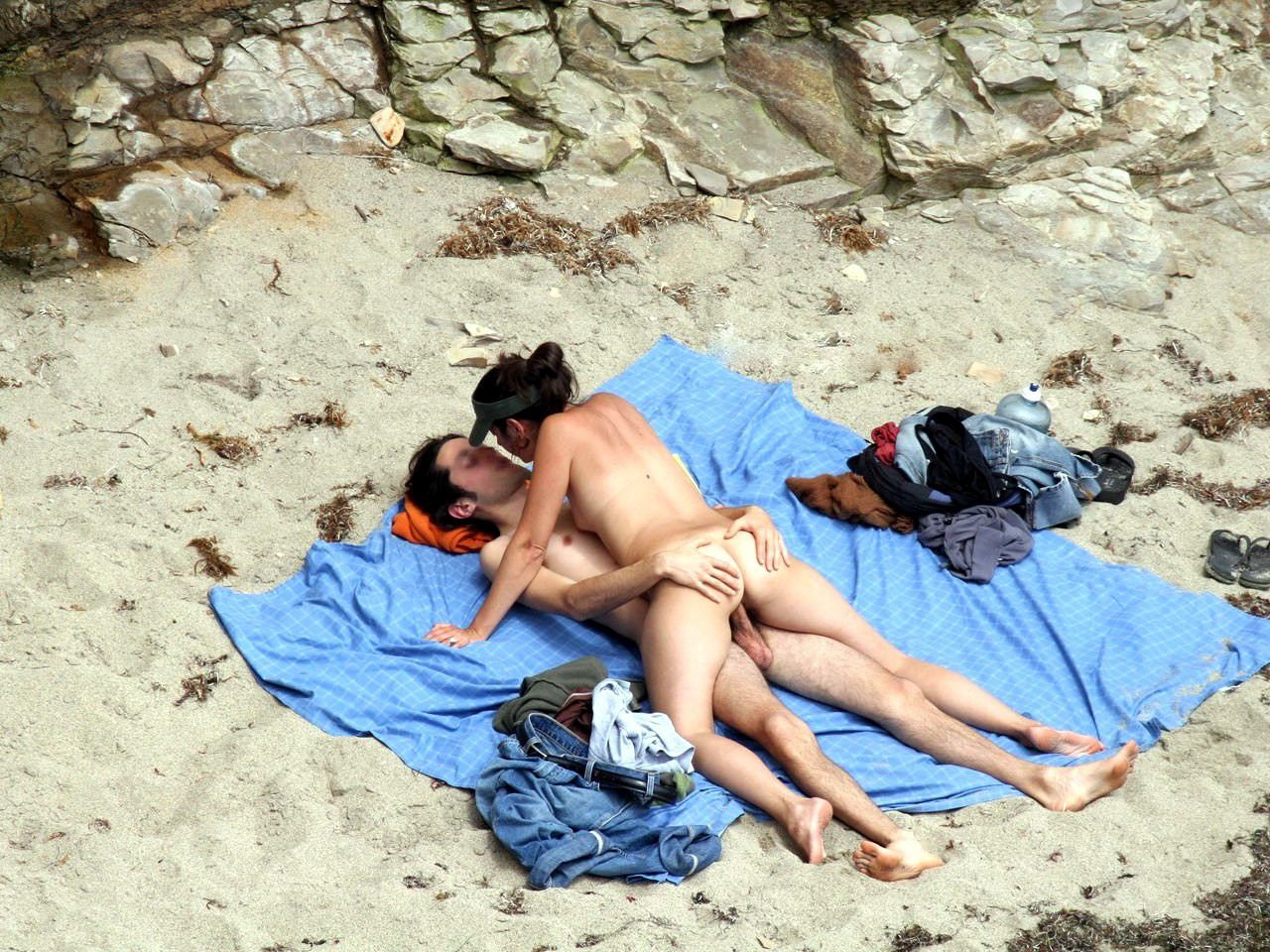 Hidden camera on the nudist beach image photo