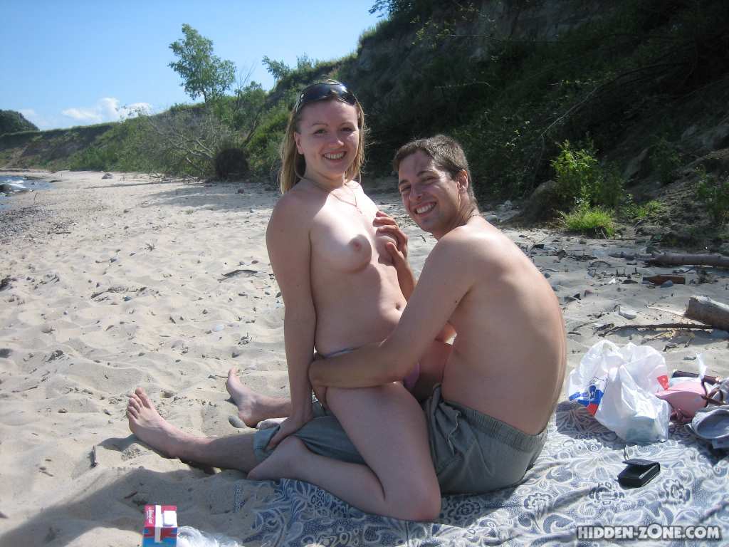 Spy cam secretly capture nude moist slits and huge boobs on the beach pic