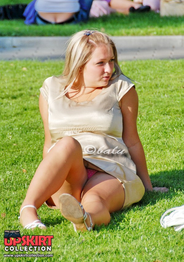 Gorgeous upskirt chick is posing on camera