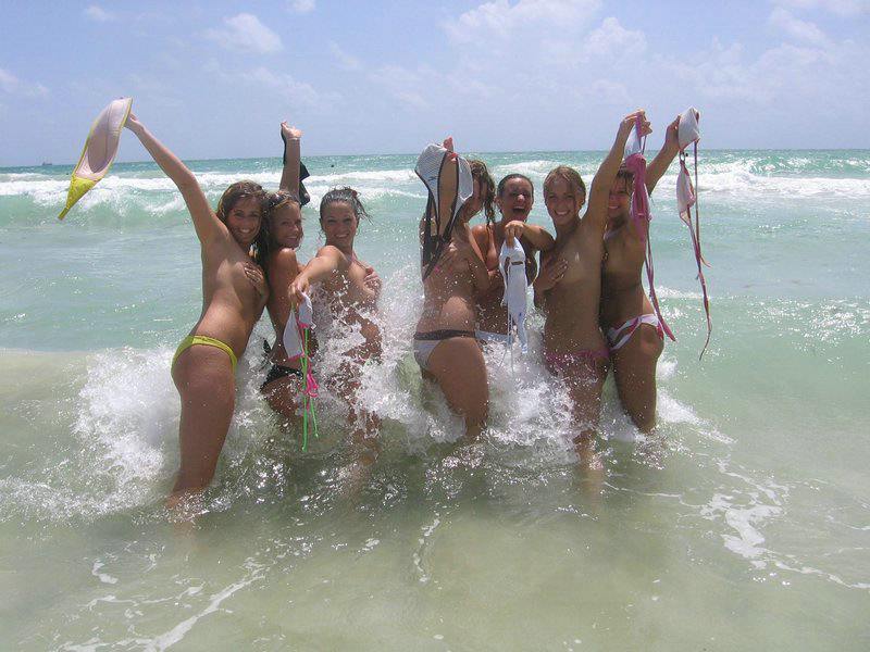 Young nudist friends naked together at the beach pic pic