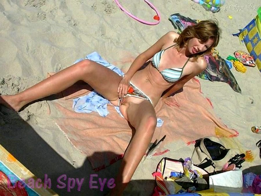Girls opens a little bikini and lets us see what it hides on beach pic