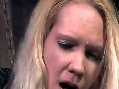 Tattooed blond slut is fucked in the dungeon