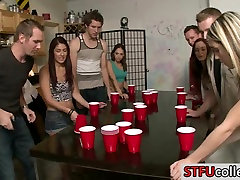 Teen students play flip cup and have infromt of husband
