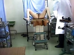 A horny gynecologist plays around with the sweet pussy of his client
