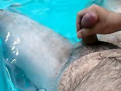 Jerking off in the pool. Hairy belly cum shot