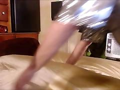 Tranny in silver bodeysuit humping satin pillow and sheets!