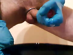 Cum on a plate with 2 layers of latex gloves
