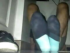 Blue sweaty socks and bare feet