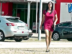 Crossdresser wears red mini dress in public