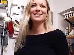 Outstanding German Milf with huge boobs dildoing her trimmed muff in the kitchen
