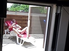 Covert webcam caught my neighbor masturbating outdoor in the pool sunbed