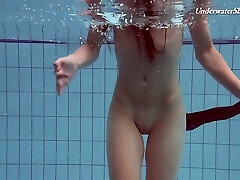 Pretty swimming babe Liza Rachinska flashes striptease under the water