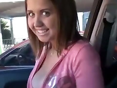 Happy young stunner in the car flashes her gorgeous tits