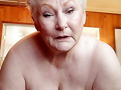 Insane Granny Showing Off Her Fat Pussy As She Rubs It With A Dildo